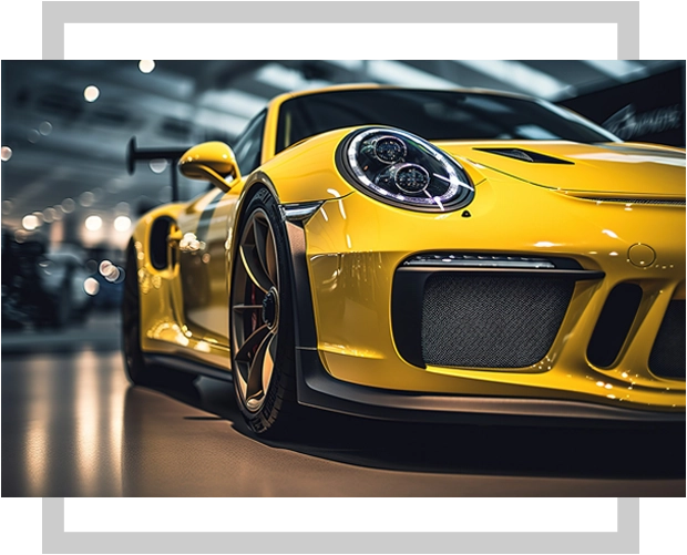 A yellow sports car is parked in a building.