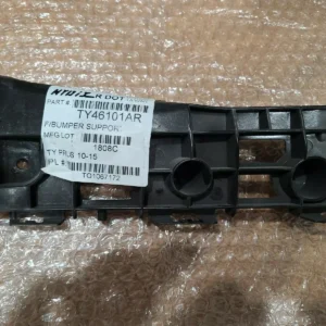 A black plastic part with numbers on it.