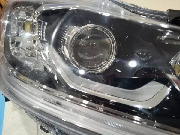 A close up of the headlight on a car