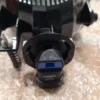 A close up of the camera flash on top of a table.