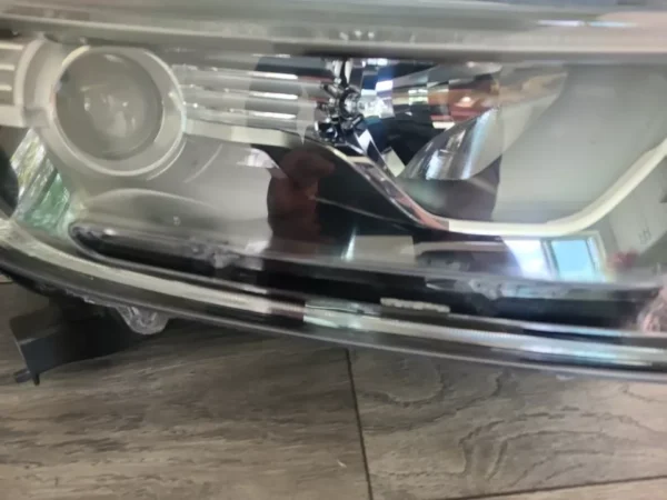 A close up of the headlight on a car