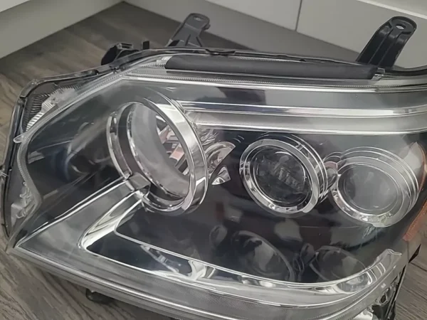 A close up of the headlights on a car