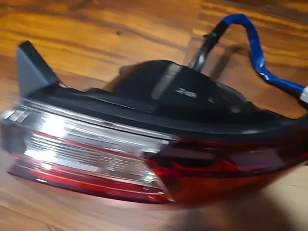 A car tail light on the floor of a room.