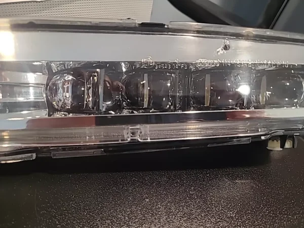 A close up of the front light on a car