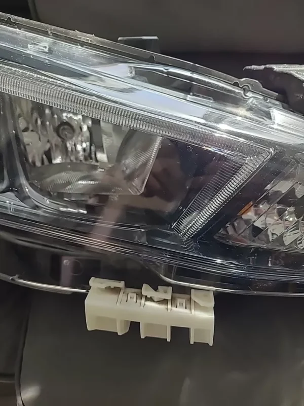 A close up of the headlight on a car