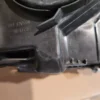 A close up of the bottom part of an engine cover.