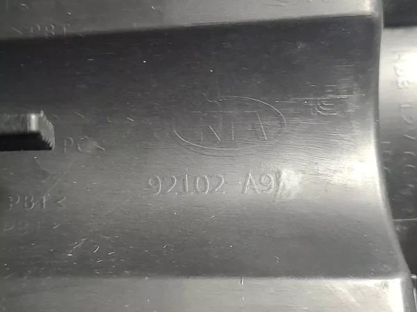 A close up of the back side of a metal object.