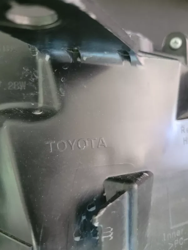 A close up of the toyota logo on a car.