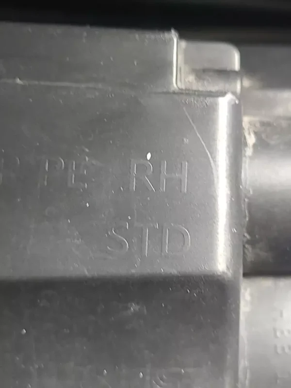 A close up of the letters on a metal object