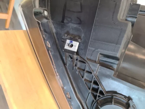 A camera is attached to the side of an oven.