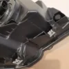 A close up of the bottom part of an engine compartment.