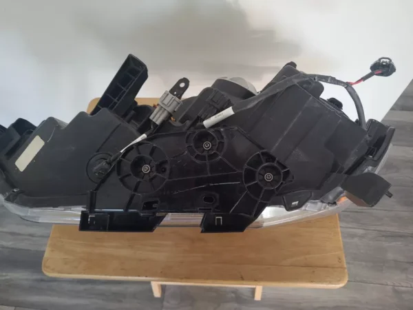 A black motor sitting on top of a wooden table.