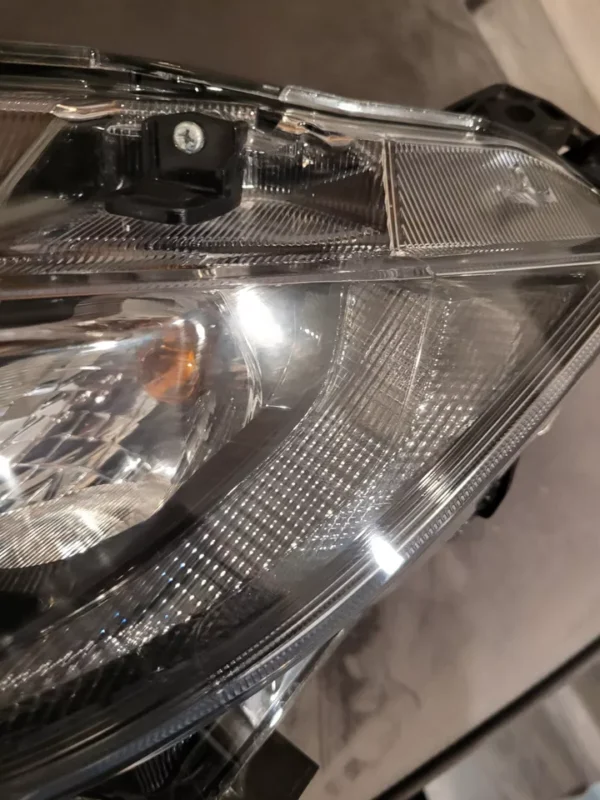 A close up of the headlight on a car