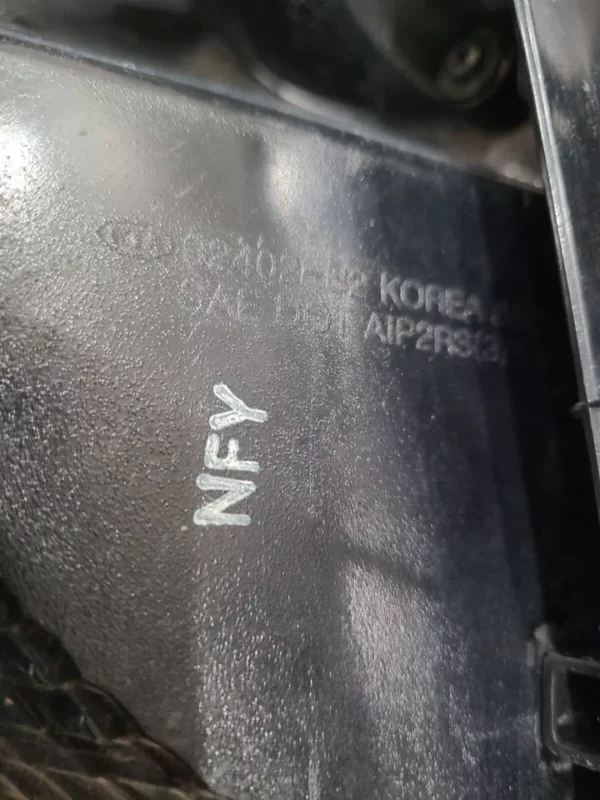 A close up of the word nfy on a piece of metal.