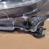 A car that is broken in half and has some wires attached to it.