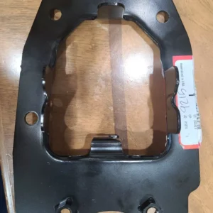 A black metal object sitting on top of a wooden table.