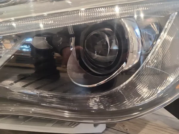 A close up of the headlight on a car