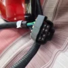 A close up of the seat belt on a car