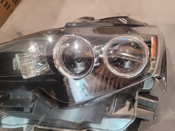 A close up of the headlights on a car