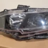 A close up of the headlight on a car