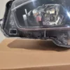 A close up of the headlight on a car
