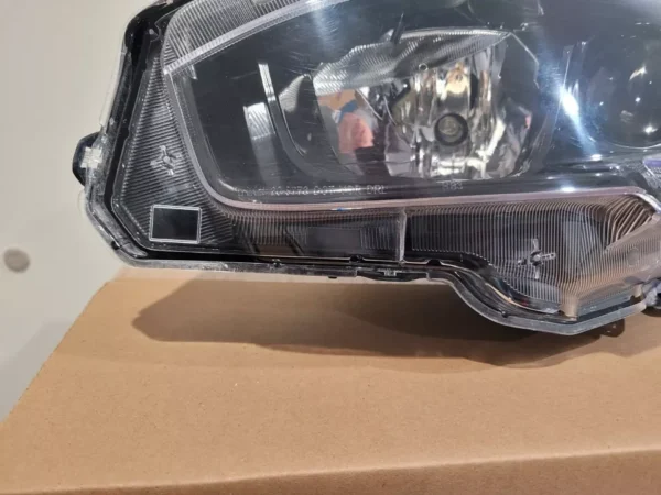 A close up of the headlight on a car