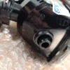 A close up of the side of a black pump.