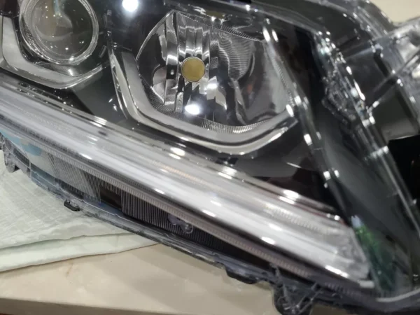 A close up of the headlight on a car