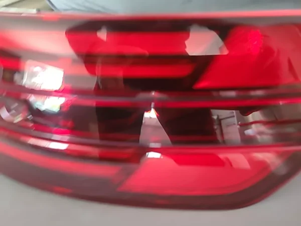 A blurry image of the back lights on a car.