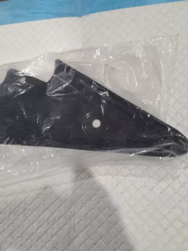 A black plastic bag with some white dots on it