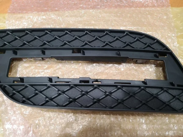 A pair of black plastic car bumper guards.