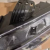 A close up of the side of a car headlight.