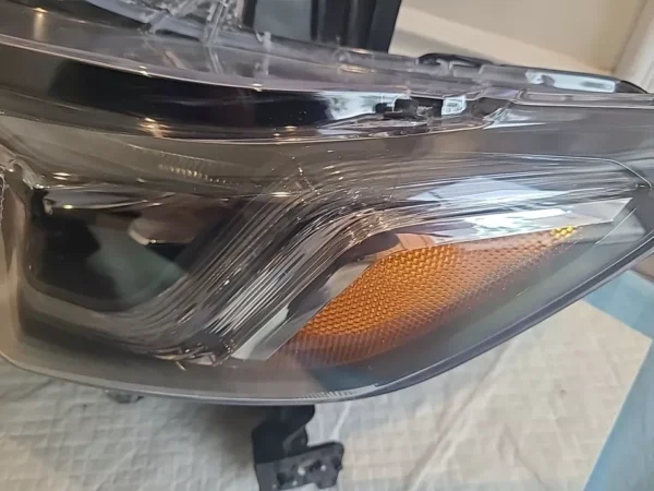 A close up of the headlight on a car