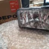 A box of packing peanuts and a light