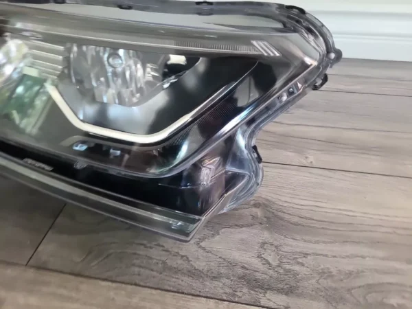 A close up of the headlight on a car