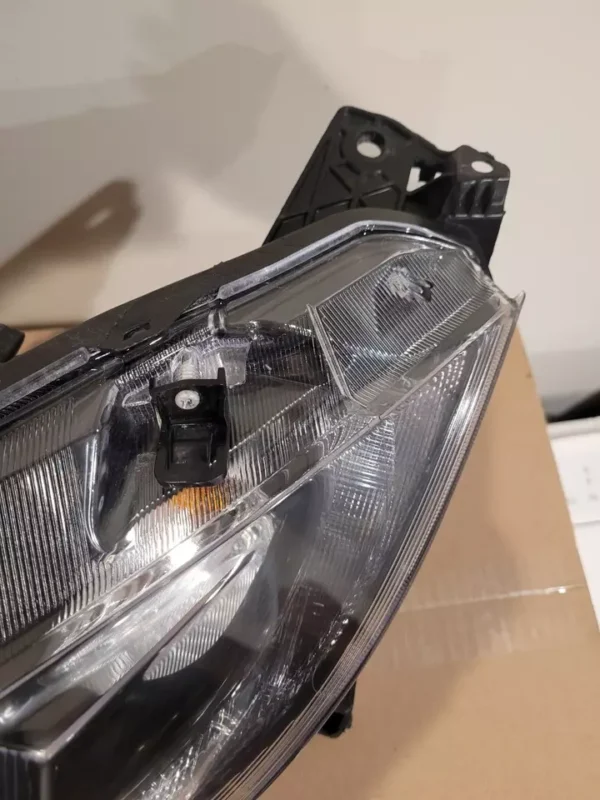 A close up of the headlight on a car