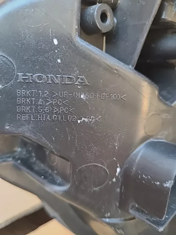 A close up of the honda logo on a motorcycle.