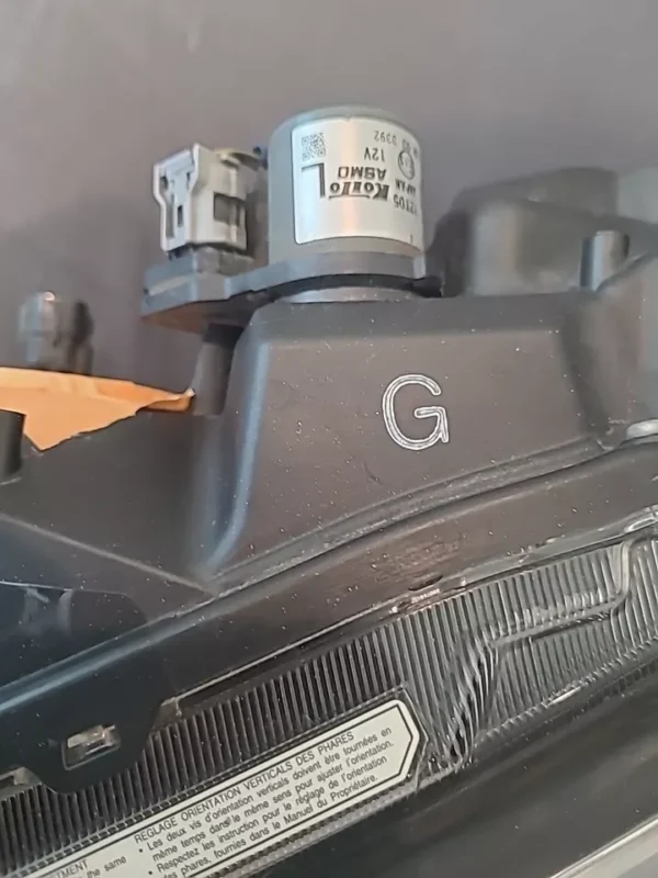 A close up of the camera lens and the g logo.