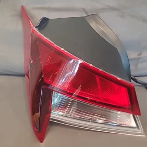 Close-up of a red and clear car tail light.