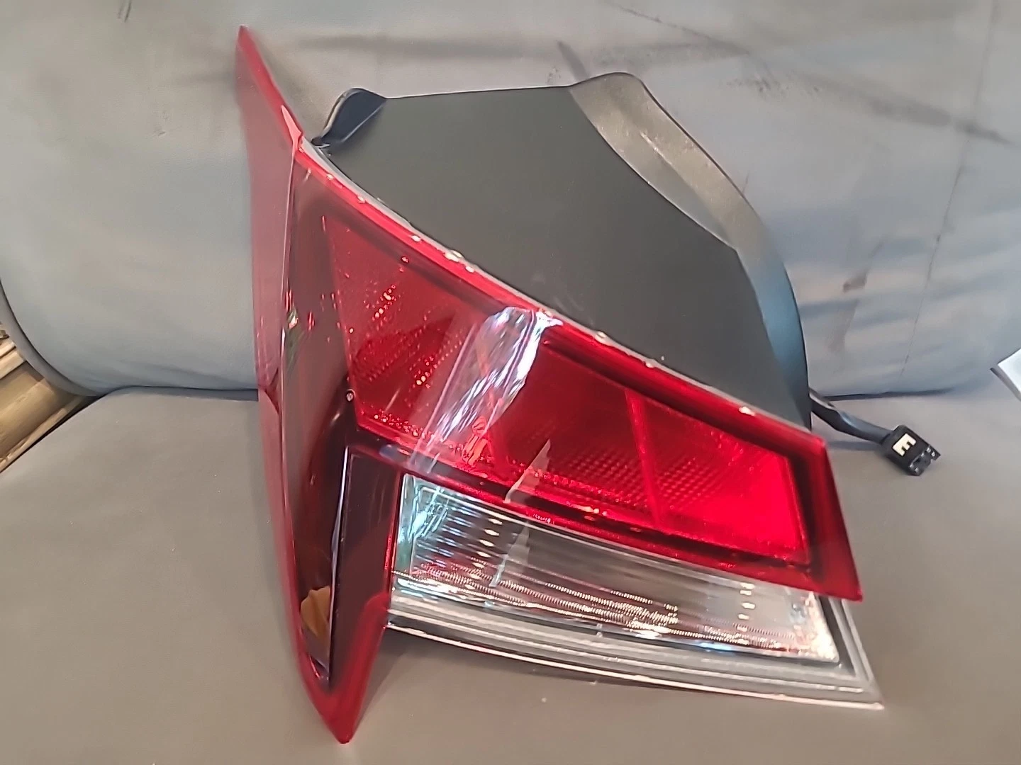 Close-up of a red and clear car tail light.