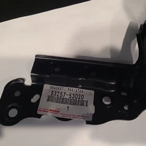 Close-up of a black metal car part with a Toyota label.